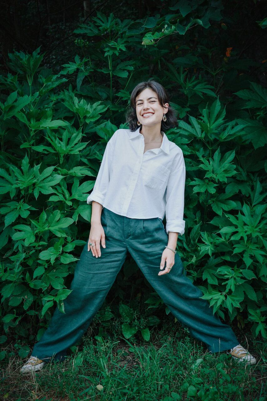 Tara Pham standing in front of foliage